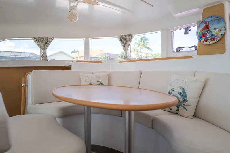 Dream Seeker Yacht Photos Pics Interior of 2011 Lagoon 380 S2 catamaran with cozy seating and decorative pillows.