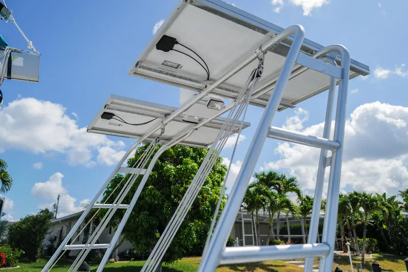 Dream Seeker Yacht Photos Pics Solar panels on a Lagoon 380 S2 catamaran, 2011 model, under a clear blue sky.
