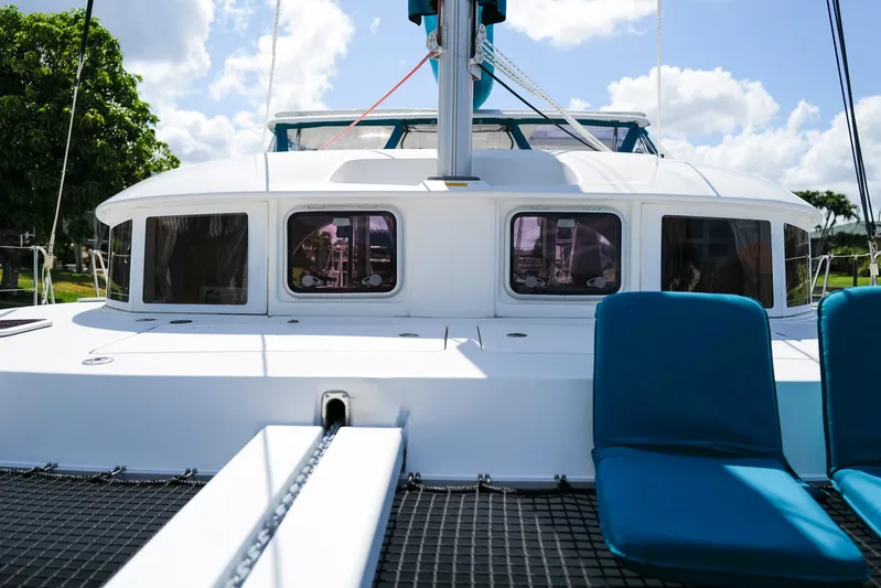 Dream Seeker Yacht Photos Pics 2011 Lagoon 380 S2 catamaran with blue seating, sunny day, clear sky.