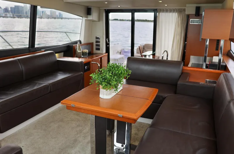  Yacht Photos Pics Luxurious interior of 2015 Prestige 550 S yacht with leather seating and waterfront view.