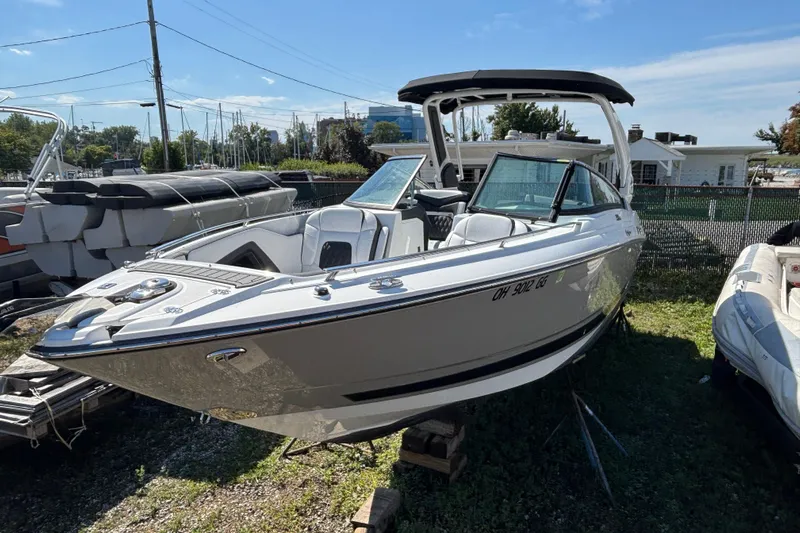  Yacht Photos Pics 2021 Monterey 298 Super Sport boat displayed outdoors on a sunny day.