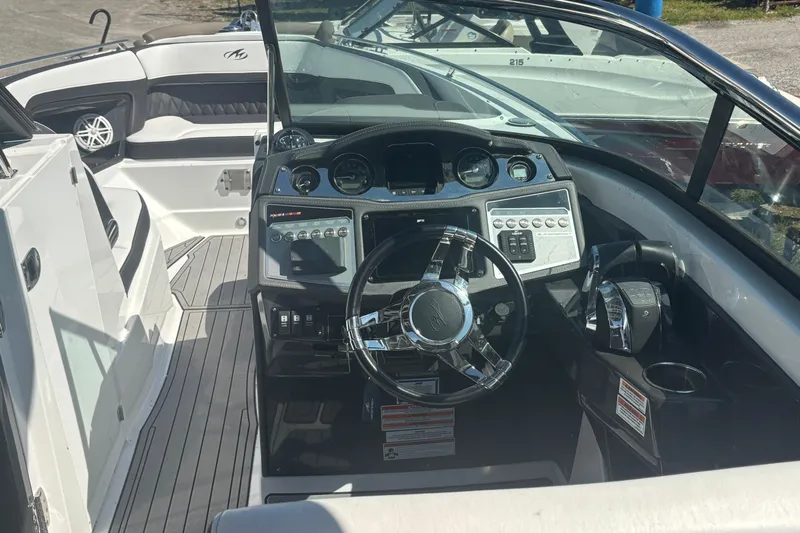  Yacht Photos Pics 2021 Monterey 298 Super Sport boat cockpit with modern steering and control panel.