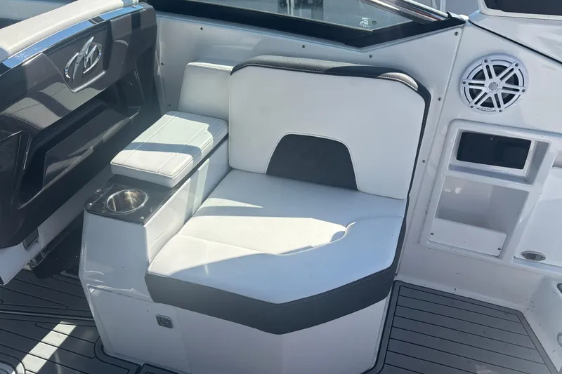  Yacht Photos Pics 2021 Monterey 298 Super Sport boat interior with white seating and cup holder.