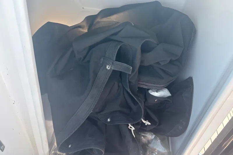  Yacht Photos Pics Black fabric stored in compartment of 2021 Monterey 298 Super Sport boat.