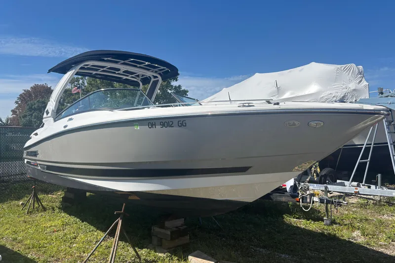  Yacht Photos Pics 2021 Monterey 298 Super Sport boat on stands, sunny day, blue sky background.
