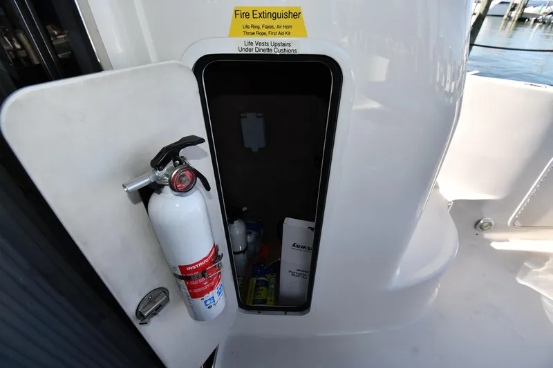 Nina Yacht Photos Pics Fire extinguisher storage on 2002 Sea Ray 480 Sedan Bridge yacht deck.