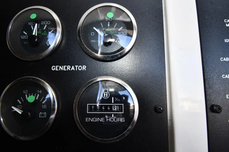 Nina Yacht Photos Pics Close-up of generator gauges on a 2002 Sea Ray 480 Sedan Bridge.
