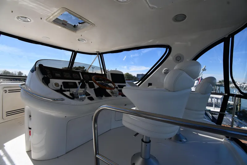 Nina Yacht Photos Pics Interior view of 2002 Sea Ray 480 Sedan Bridge yacht cockpit with modern controls.