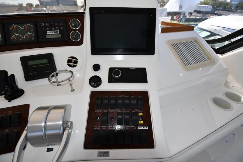 Nina Yacht Photos Pics Control panel of a 2002 Sea Ray 480 Sedan Bridge yacht with navigation and monitoring systems.