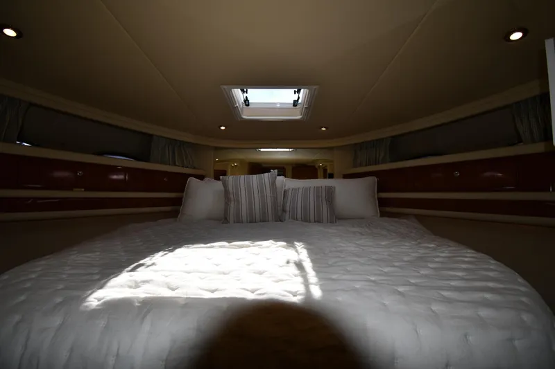 Nina Yacht Photos Pics Luxurious bedroom interior of 2002 Sea Ray 480 Sedan Bridge yacht with skylight.