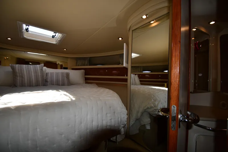 Nina Yacht Photos Pics Luxurious 2002 Sea Ray 480 Sedan Bridge cabin interior with plush bedding and elegant lighting.