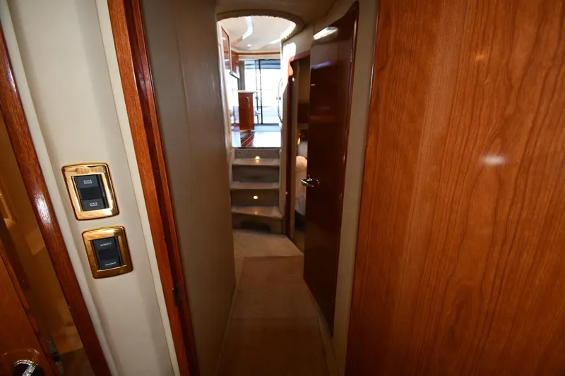 Nina Yacht Photos Pics Interior hallway of 2002 Sea Ray 480 Sedan Bridge yacht with wooden finishes.