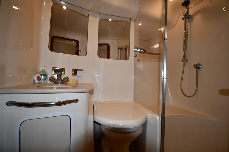 Nina Yacht Photos Pics Luxurious bathroom in 2002 Sea Ray 480 Sedan Bridge yacht with shower and sink.