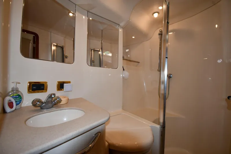 Nina Yacht Photos Pics Luxurious bathroom in 2002 Sea Ray 480 Sedan Bridge yacht with modern fixtures.