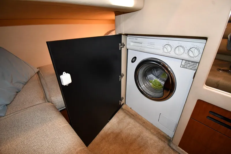 Nina Yacht Photos Pics 2002 Sea Ray 480 Sedan Bridge interior with built-in washer and cozy seating area.