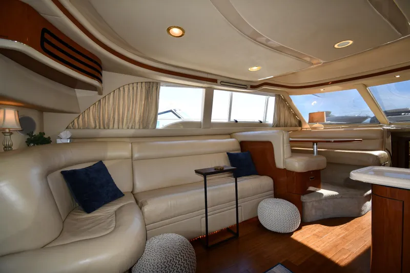 Nina Yacht Photos Pics Luxurious interior of 2002 Sea Ray 480 Sedan Bridge yacht with elegant seating and decor.