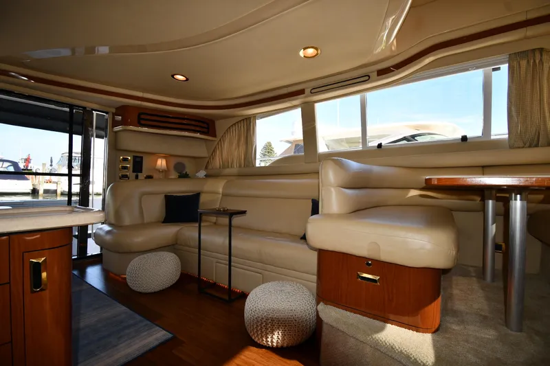 Nina Yacht Photos Pics Luxurious interior of a 2002 Sea Ray 480 Sedan Bridge yacht with plush seating.