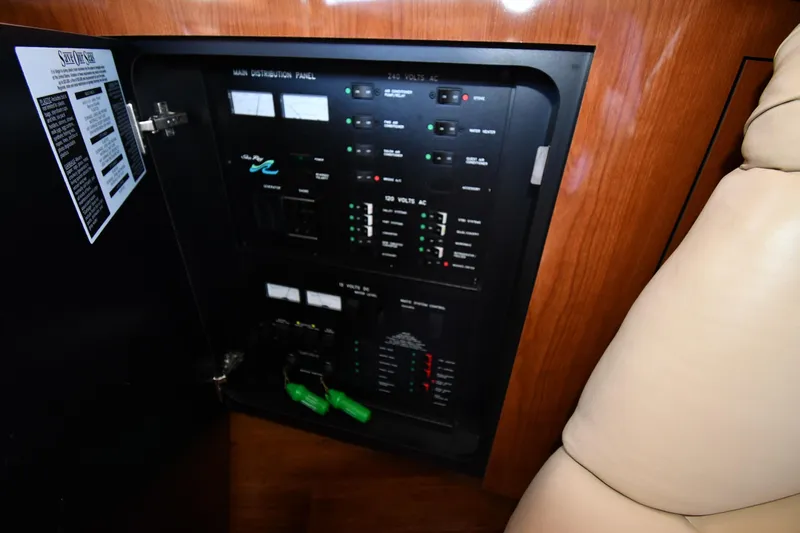 Nina Yacht Photos Pics Electrical panel inside 2002 Sea Ray 480 Sedan Bridge yacht, featuring control switches and indicators.