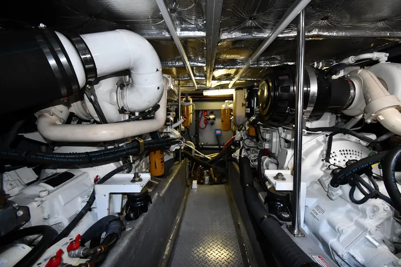 Nina Yacht Photos Pics Engine room of a 2002 Sea Ray 480 Sedan Bridge yacht, showcasing mechanical components.