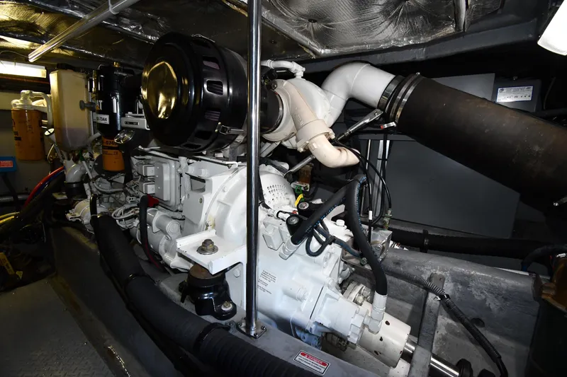 Nina Yacht Photos Pics Engine room of 2002 Sea Ray 480 Sedan Bridge yacht, showcasing mechanical components.