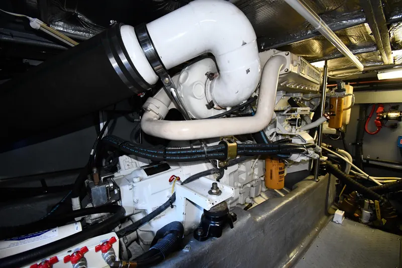 Nina Yacht Photos Pics Engine room of 2002 Sea Ray 480 Sedan Bridge yacht, showcasing mechanical components.