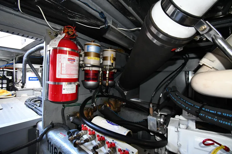 Nina Yacht Photos Pics Engine room of 2002 Sea Ray 480 Sedan Bridge with fire extinguisher and fuel filters.
