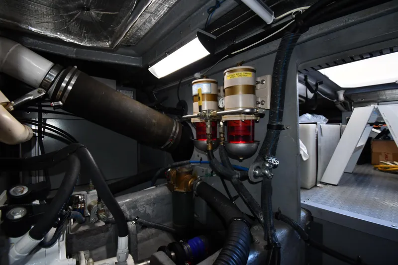 Nina Yacht Photos Pics Engine room of 2002 Sea Ray 480 Sedan Bridge with visible components and piping.