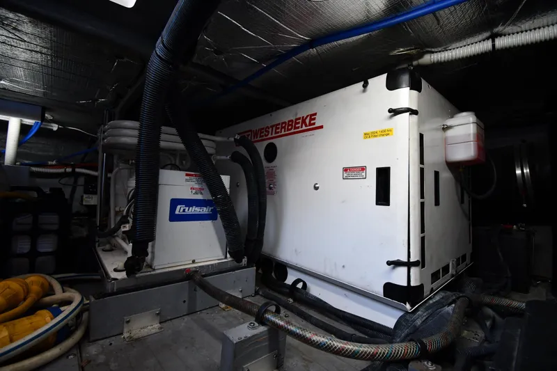 Nina Yacht Photos Pics Engine room of 2002 Sea Ray 480 Sedan Bridge with Westerbeke generator and Cruisair system.