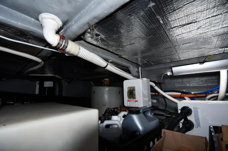 Nina Yacht Photos Pics Engine room of 2002 Sea Ray 480 Sedan Bridge with pipes and equipment.