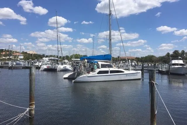 Stimulus Package Yacht Photos Pics 2009 Seawind 36 1000XL catamaran docked in a marina under a blue sky.
