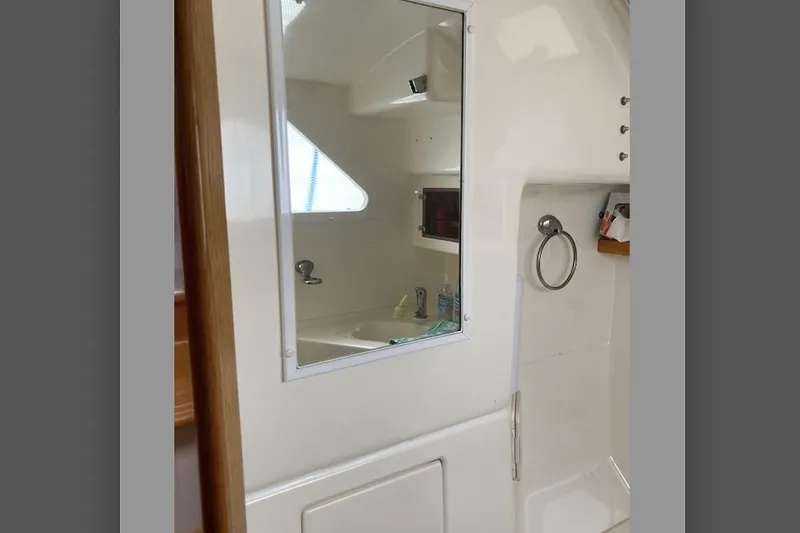Stimulus Package Yacht Photos Pics Interior of 2009 Seawind 36 1000XL yacht bathroom with mirror and sink.