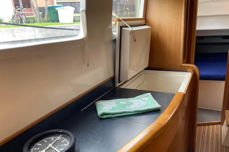 Stimulus Package Yacht Photos Pics Interior of 2009 Seawind 36 1000XL yacht with countertop and compass.