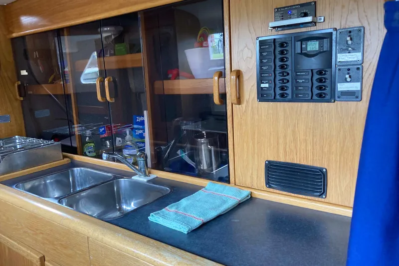 Stimulus Package Yacht Photos Pics 2009 Seawind 36 1000XL yacht kitchen with dual sinks and control panel.