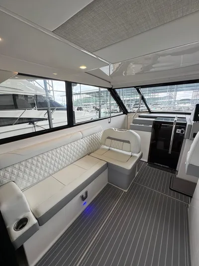  Yacht Photos Pics Luxurious interior of 2023 Regal 36 Grande Coupe yacht with elegant seating and modern design.