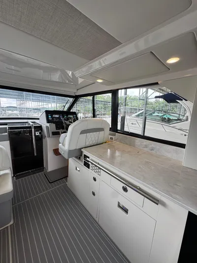  Yacht Photos Pics Interior of 2023 Regal 36 Grande Coupe yacht with modern helm and sleek design.