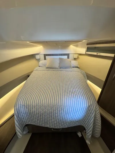  Yacht Photos Pics Luxurious bedroom interior of 2023 Regal 36 Grande Coupe yacht.