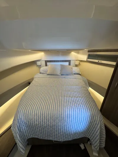  Yacht Photos Pics Interior cabin of 2023 Regal 36 Grande Coupe with cozy bed and modern design.