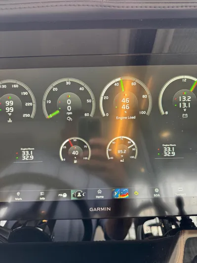  Yacht Photos Pics Dashboard of 2023 Regal 36 Grande Coupe showing engine metrics and Garmin interface.