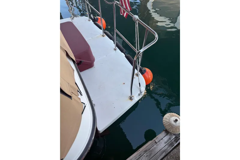  Yacht Photos Pics 2016 Ranger Tugs R-31 CB boat stern with railing and docked at marina.