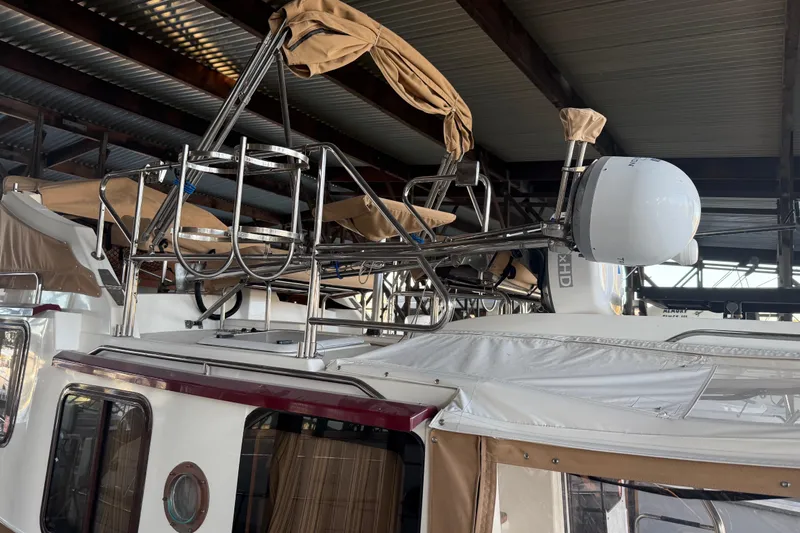  Yacht Photos Pics 2016 Ranger Tugs R-31 CB boat with radar and canopy, docked indoors.