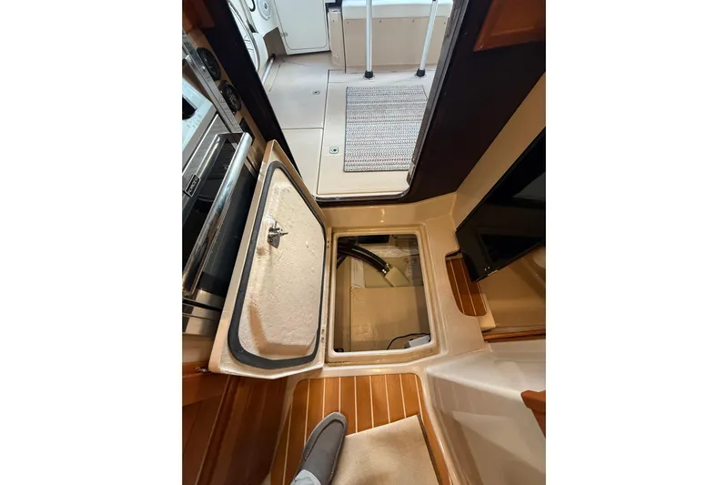  Yacht Photos Pics 2016 Ranger Tugs R-31 CB interior with open hatch and wooden flooring.