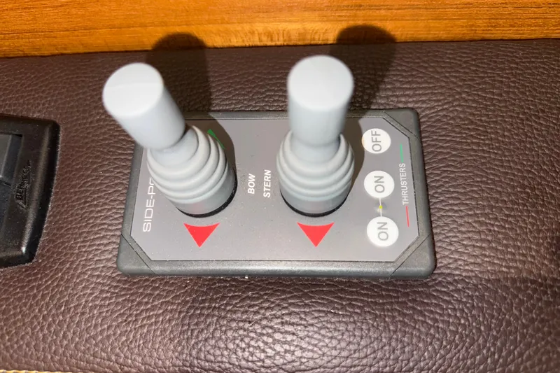  Yacht Photos Pics Joystick controls for 2016 Ranger Tugs R-31 CB boat thrusters on leather surface.