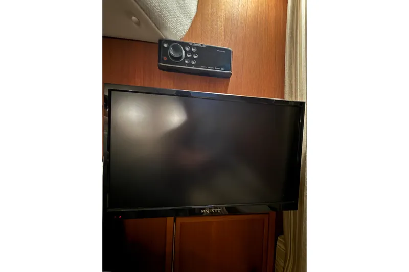  Yacht Photos Pics Flat-screen TV and control panel inside 2016 Ranger Tugs R-31 CB boat cabin.
