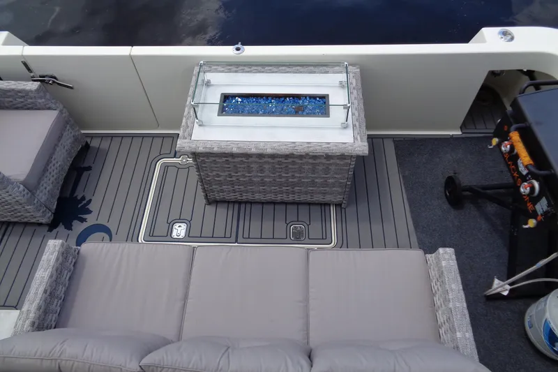 Ivory Lady Yacht Photos Pics 1987 Hatteras 70 Cockpit Motor Yacht deck with seating and fire pit table.