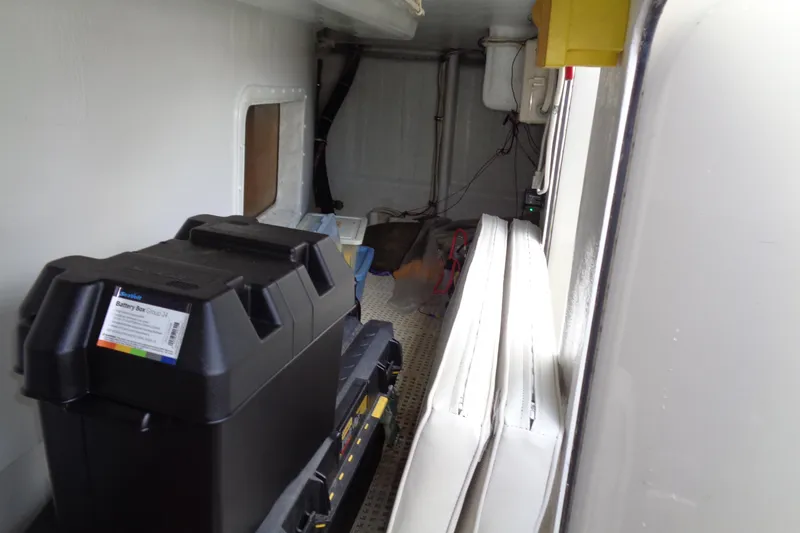 Ivory Lady Yacht Photos Pics Interior view of 1987 Hatteras 70 Cockpit Motor Yacht showing storage and battery box.