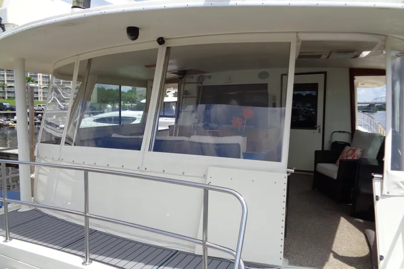 Ivory Lady Yacht Photos Pics 1987 Hatteras 70 Cockpit Motor Yacht with enclosed deck and seating area.