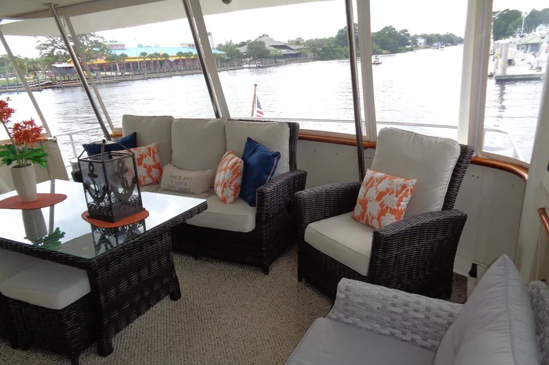 Ivory Lady Yacht Photos Pics Luxurious 1987 Hatteras 70 Cockpit Motor Yacht interior with elegant seating and decor.