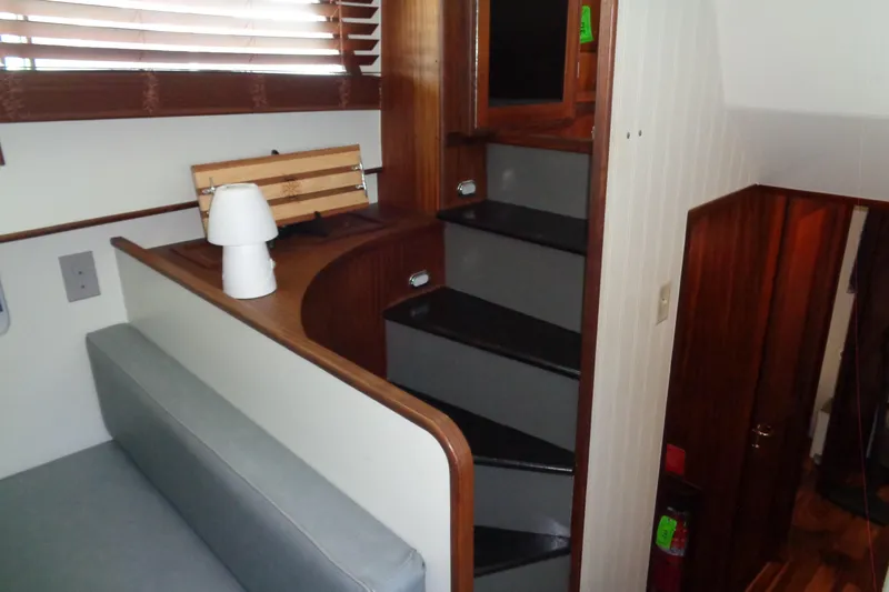 Ivory Lady Yacht Photos Pics Interior of 1987 Hatteras 70 Cockpit Motor Yacht with stairs and seating area.
