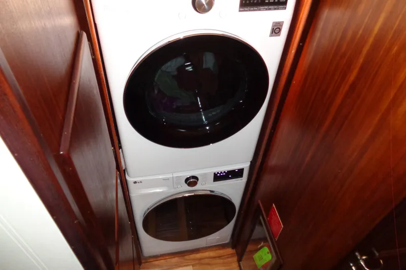 Ivory Lady Yacht Photos Pics Stacked washer and dryer in 1987 Hatteras 70 Cockpit Motor Yacht laundry area.