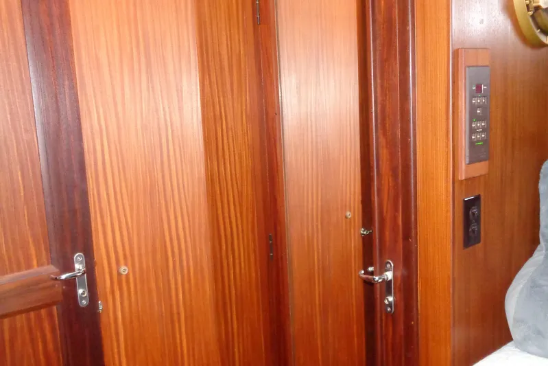 Ivory Lady Yacht Photos Pics Interior of 1987 Hatteras 70 Cockpit Motor Yacht with wooden doors and control panel.